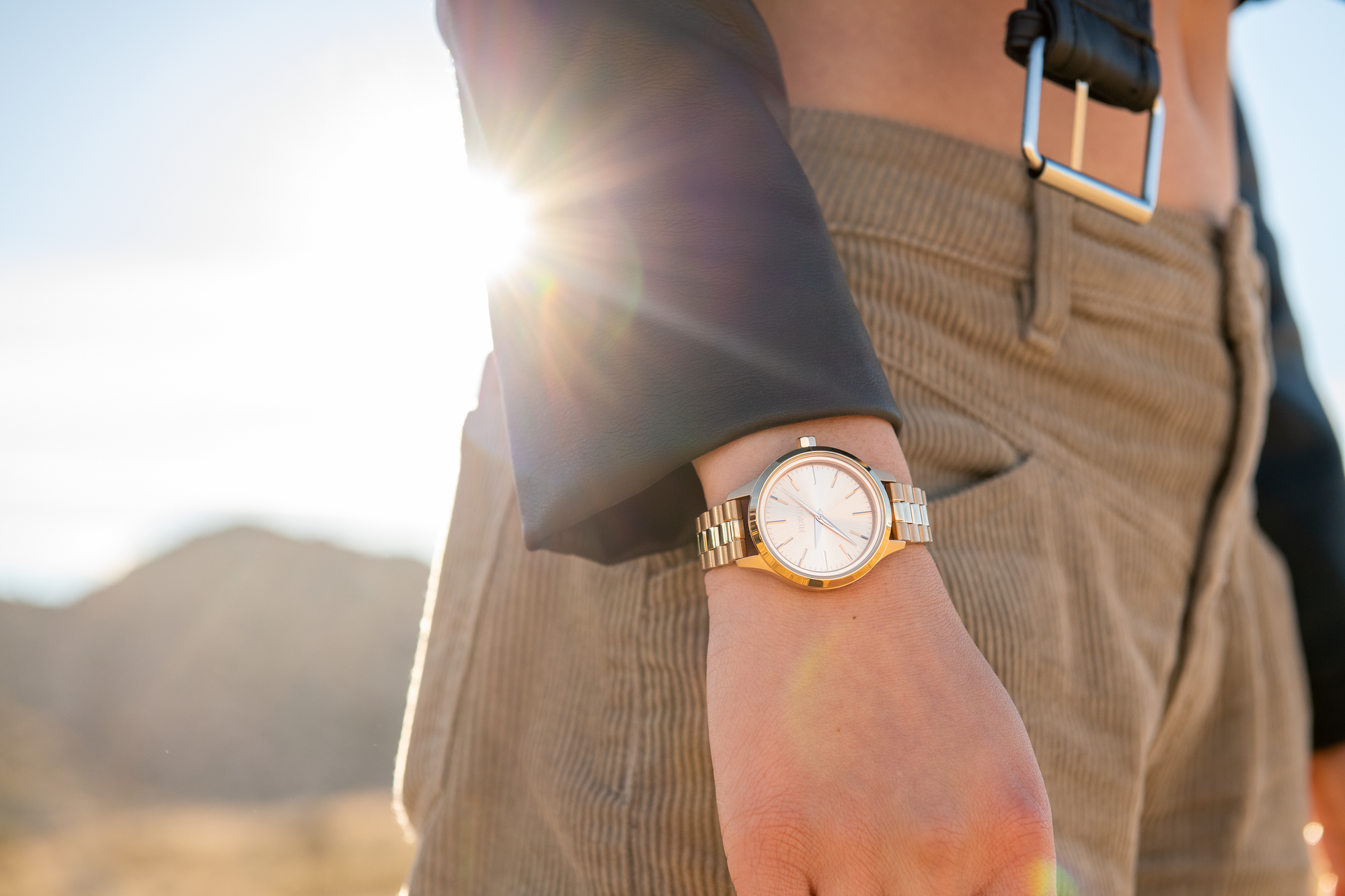 Woman wearing the Nixon Optimist solar watch in Joshua Tree desert